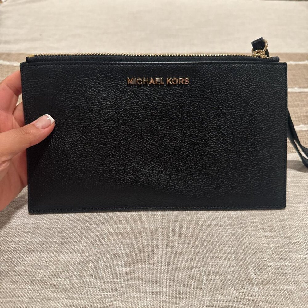 MICHAEL KORS black leather clutch with wrist strap.